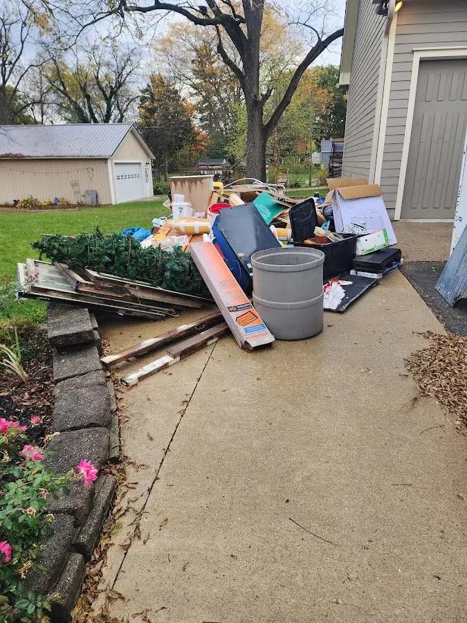Dumpster being loaded with debris for Roofing Dumpster Rental in Norwalk